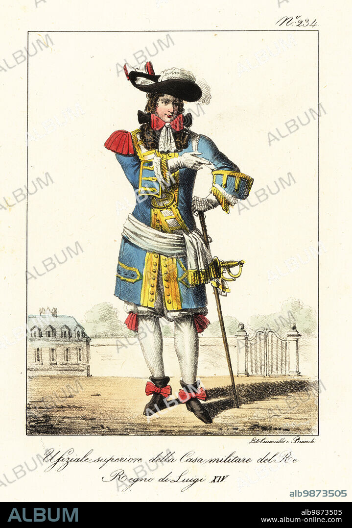 Uniform of a Superior Officer in the French Military Household of the King of France, reign of King Louis XIV. Plumed hat, blue coat with epaulette and gold frogging, cravatte with ribbons, pantalons, hose, ribbon bootlets, armed with sword and staff. Officier superieur de la Maison Militaire du Roi. Regne de Louis XIV. Handcoloured lithograph by Lorenzo Bianchi and Domenico Cuciniello after Hippolyte Lecomte from Costumi civili e militari della monarchia francese dal 1200 al 1820, Naples, 1825. Italian edition of Lecomtes Civilian and military costumes of the French monarchy from 1200 to 1820.