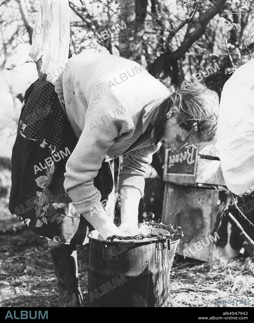 Gypsy woman washing clothes, 1960s.