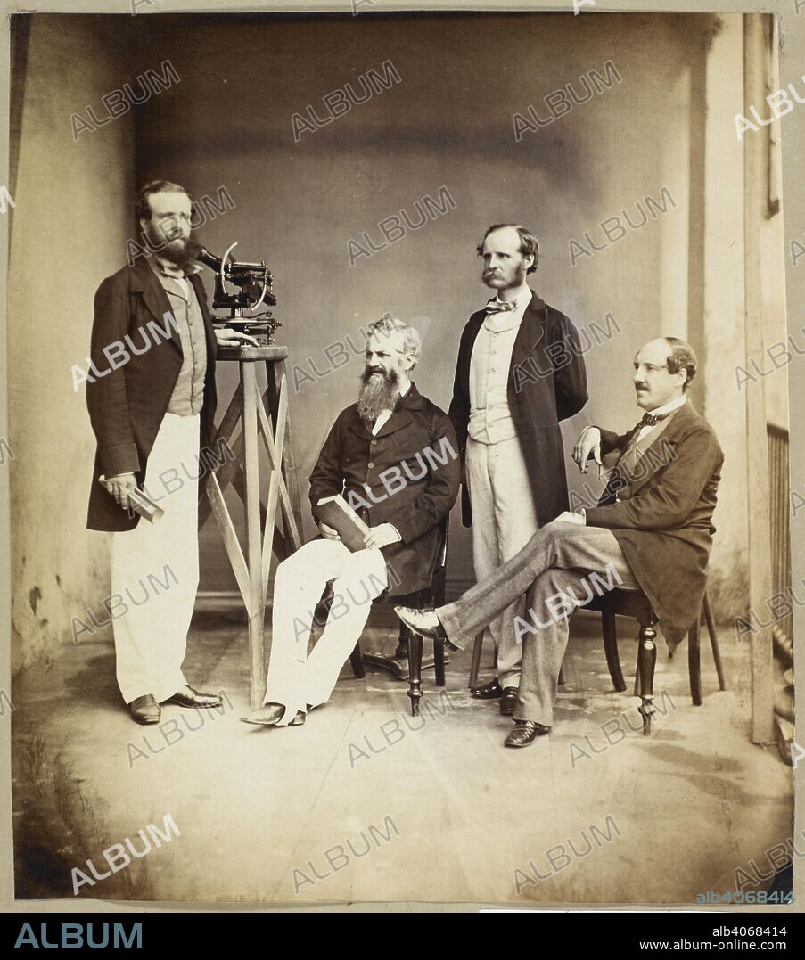 Group of Trigonometrical Survey of India staff. A portrait group with a theodolite. The four figures in the group are (left to right): Thomas George Montgomerie; Sir Andrew Scott Waugh; James Thomas Walker; Sir Henry Edward Landor Thuillier. Yule Collection: Album of Portraits. c. 1857. Photograph. Source: Photo 139/1(2).