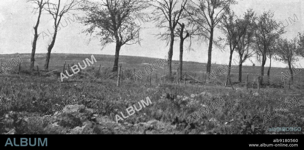 'Aspects du champ de bataille de Verdun; La route, plantee d'arbres d'Esnes a Bethincourt et, au fond, les pentes Est de la cote 304', 1916. From "Collection de la Guerre IV. L'Illustration Tome CXLVII. La Guerre Janvier, Fevrier, Mars, Avril, Mai, Juin 1916".