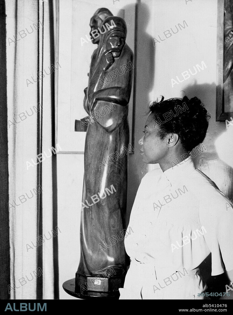 Envy, sculpture in wood. Augusta Savage (February 29, 1892 - March 27, 1962) was an African-American sculptor associated with the Harlem Renaissance. The Savage Studio of Arts and Crafts, located in a basement on West 143rd Street in Harlem, was open to anyone who wanted to paint, draw, or sculpt. She was the first African-American artist to be elected to the National Association of Women Painters and Sculptors and one of four women and only two African-Americans to receive a professional commission from the Board of Design of the 1939 New York World's Fair. Much of her work is in clay or plaster, as she could not often afford bronze. Herman, 1938 (cropped and cleaned).