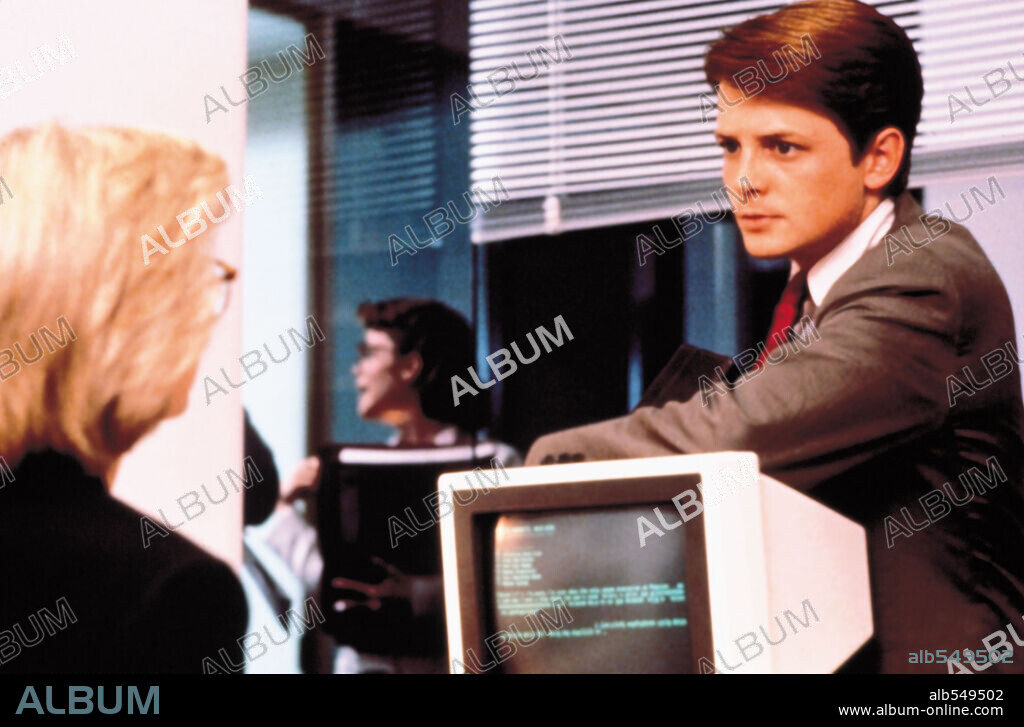 MICHAEL J. FOX en EL SECRETO DE MI ÉXITO, 1987 (THE SECRET OF MY SUCCE$S), dirigida por HERBERT ROSS. Copyright UNIVERSAL PICTURES.