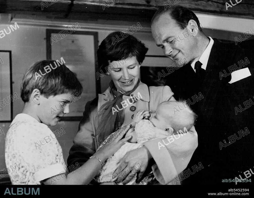 Capt. Scott's Grand-Daughter Christened in ***** - Mrs. Peter Scott, the mother, holds Dafila Kathleen, while Mr. Peter Scott and his daughter by his first marriage, Nicola, look on. They are pictured in the discovery's museum, surrounded by relics of captain Scott.
The Grand-daughter of captain Robert Falcom Scott, the famous British Antarctic explorer, ***** Christened today aboard her grandfather's ship, the discovery, moored in the Thames. The ship was used in the British National Antarctic expedition of 1901-4. September 17, 1952. (Photo by Paul Popper).