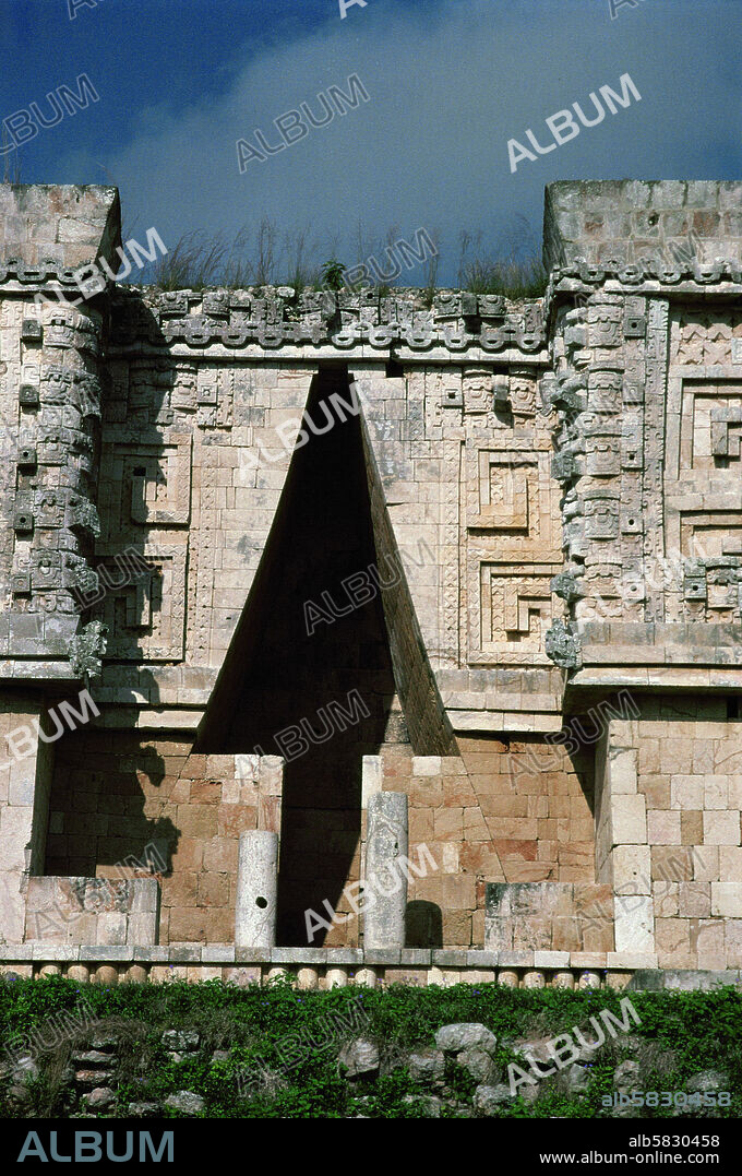 Maya Arch in the facade of the Palace of the Governor, Uxmal. The triangular Maya arches are false arches, consisting of corbeled stone slabs meeting at the summit in a point. The cornice of this arch is formed by an undulating snake (7th-10th CE) .