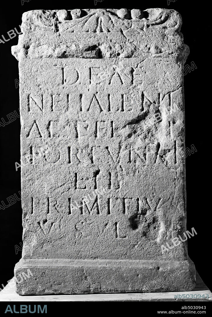 Limestone. Altar of Nehalennia, dedicated by Primitius. The altar is covered with an excellent frame with a kind of cushion decoration, on the front with leaf and fruit ornamentation, otherwise it is undecorated., Altar, stone, limestone, 69 x 40 cm, roman 150-250, the Netherlands, Zeeland, Veere , Domburg.