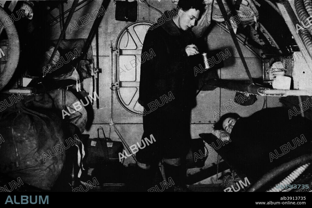 An RAF rigger serving breakfast at 6.30 am, c1940 (1943). From Coastal Command. [His Majesty's Stationery Office, London, 1943].