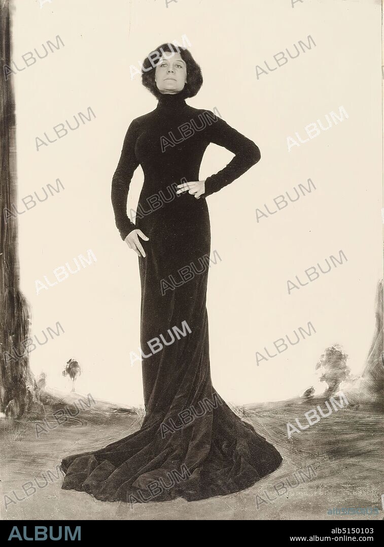 Hugo Erfurth, Marya Delvard, from the album Ausstellung Hugo Erfurth - Bildnisse aus dem XX. Jahrhundert, Konstanz 1949, silver gelatin paper, black and white positive process, retouched (stone processing), image size: height: 22.8 cm; width: 16.8 cm, signed and inscribed, einbelichtet: Hugo Er[ hardly legible], label: Passepartout recto u. in the middle: in machine print on Japanese paper: H u g o E r f u r t h, 'Maria Delvard', portrait photography, portrait, woman, singer, actor, actress, standing figure, dress, stagecraft, full-length portrait, Marya Delvard, At the beginning of the 20th century, the artist was a member of the Hugo Er family. At the beginning of the 20th century, Hugo Erfurth, along with Rudolph Dührkoop and Nicola Perscheid, was one of the most famous professional photographers in Germany. After completing an apprenticeship as a photographer, he opened his own studio in Dresden at the age of only 22. Soon Erfurth orientated himself towards the up-and-coming pictorialist photography, participated in numerous amateur photographic exhibitions from 1894 onwards and managed to make a name for himself both as an artistically ennobled amateur and successful professional photographer. Portraits are central to his work, which he began taking in 1906 in his new studio, a classicist palace, in a stylishly elegant ambience, appealing to the wealthy bourgeoisie. He also produced numerous portraits of famous personalities, including Käthe Kollwitz, Otto Dix and Joachim Ringelnatz. While his studies around 1905 still show full-length figures depicted in an atmospheric way, from the 1920s onward the focus is on the face, which is photographed against a simple monochrome background. Here, his pictorial approach corresponds to the portrait of classical modernism, whereby the technique of oil printing emphasizes the softness and materiality of the pigments and at the same time places the portraits in the art-photographic tradition. Erfurth is a co-founder of th.