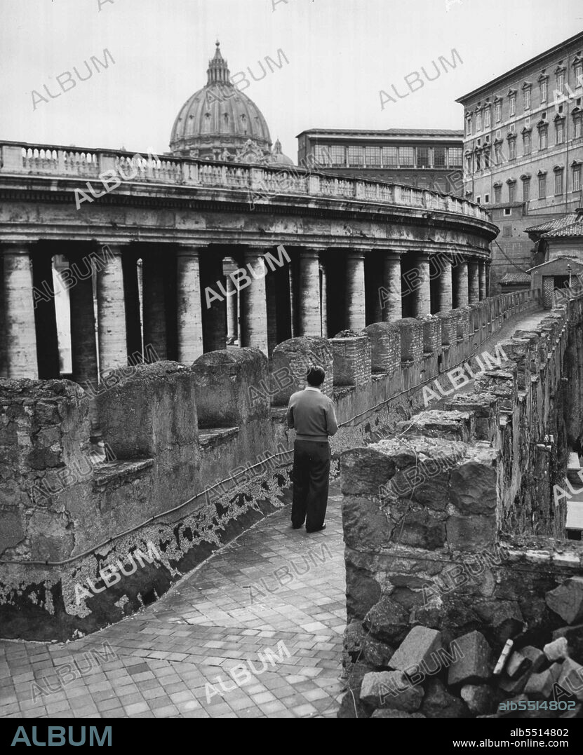 Forgotten Passageway -- Approaching St. Peter's Basilica, the passageway leads past the famed three into the Bernini colonnade into the guardhouse and from three into the Apostolic Palace, residence of the Pope. Pope Pius XII lives on the top floor of the building. October 1, 1954. (Photo by United Press).