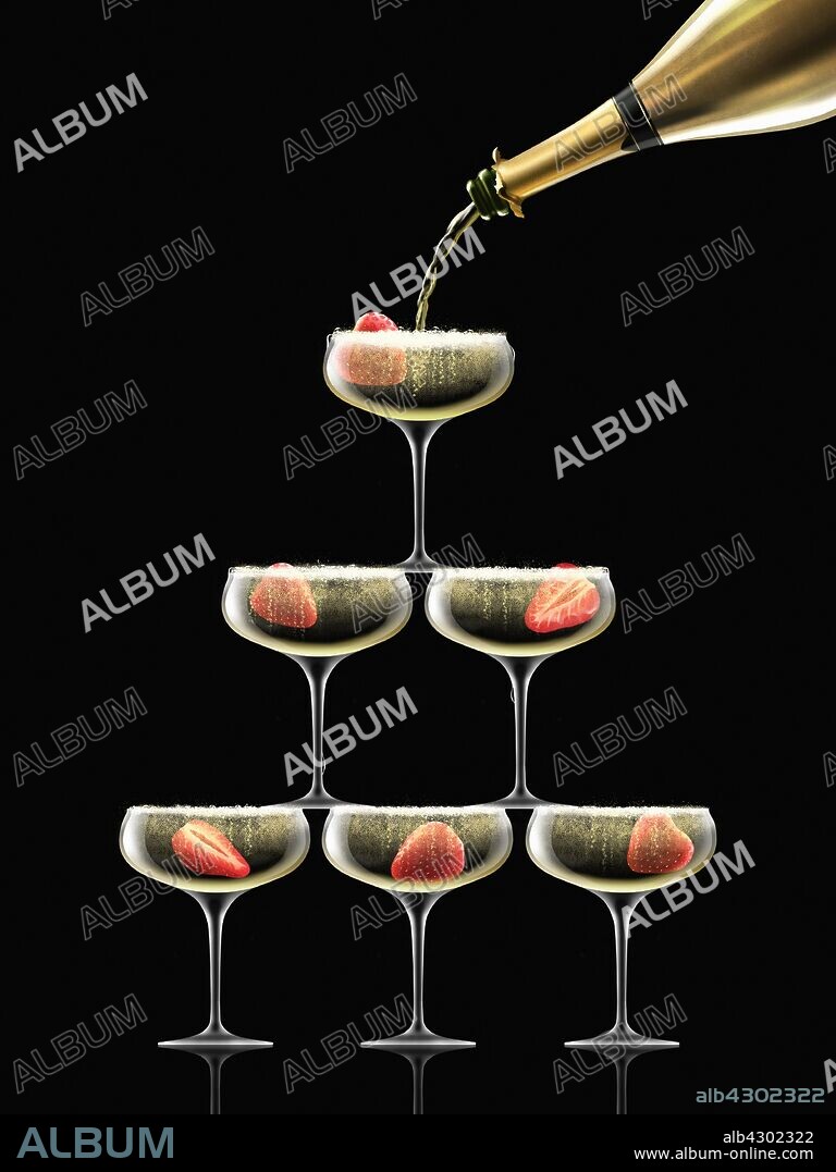 Gold champagne bottle filling coupe glasses in champagne pyramid.