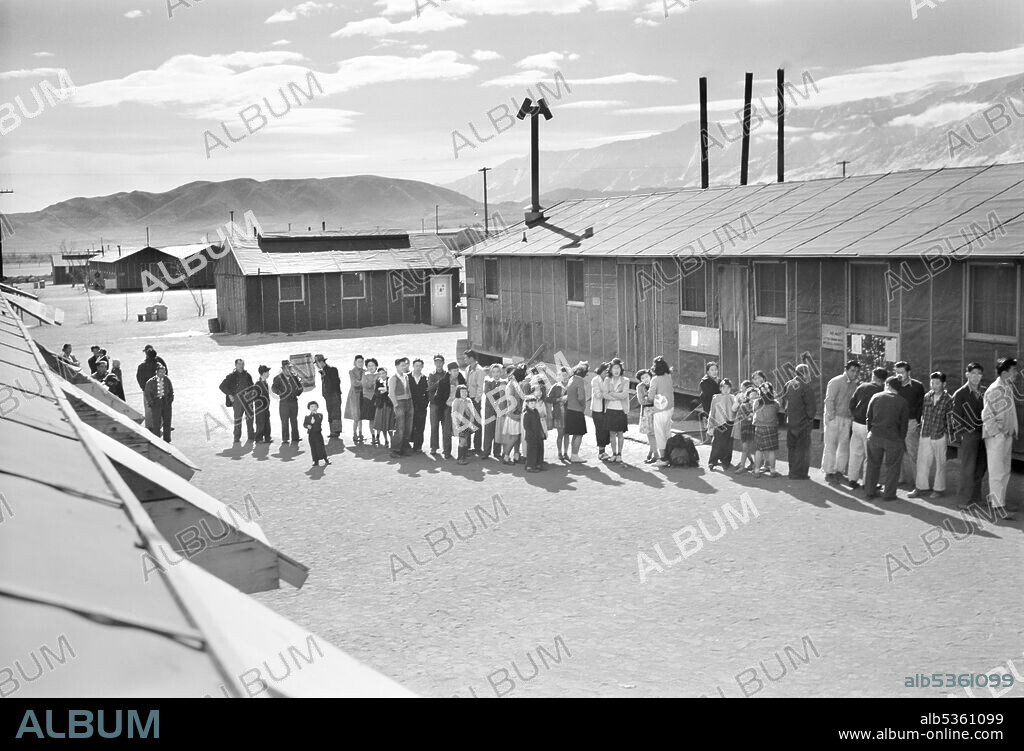 Japanese-Americans waiting in line at Mess Hall, Manzanar Relocation Center, California, USA, Ansel Adams, Manzanar War Relocation Center Collection, 1943.
