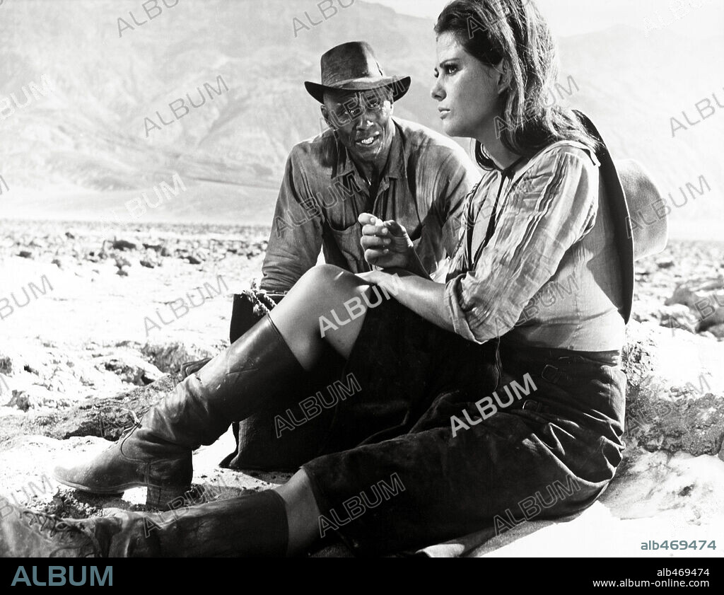 CLAUDIA CARDINALE and WOODY STRODE in THE PROFESSIONALS, 1966, directed by RICHARD BROOKS. Copyright COLUMBIA PICTURES.