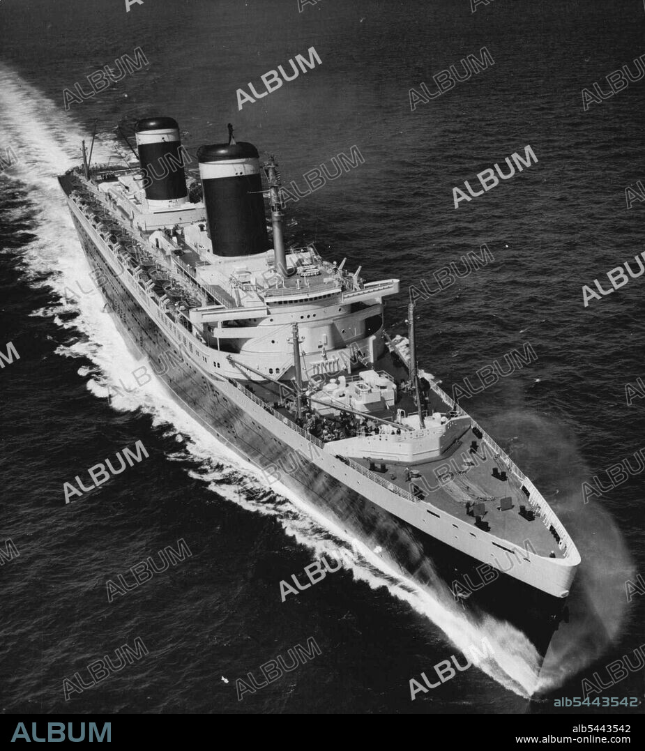 The New Holder Of The Blue Riband -- After her record-breaking crossing of the Atlantic ocean, the 53,300-ton liner "United States" steams across the English channel to Le Havre, France. This picture was made from the air this morning, July 7, after the vessel, largest ever built in the U.S.A., sailed from the ambrose light outside New York, to Bishop rock, off lands end, Cornwall, in three days, ten hours, 40 minutes, on her maiden voyage. These marks, 2,938 miles apart, are the beginning and end of the blue riband course. July 15, 1952. (Photo by Associated Press Photo).