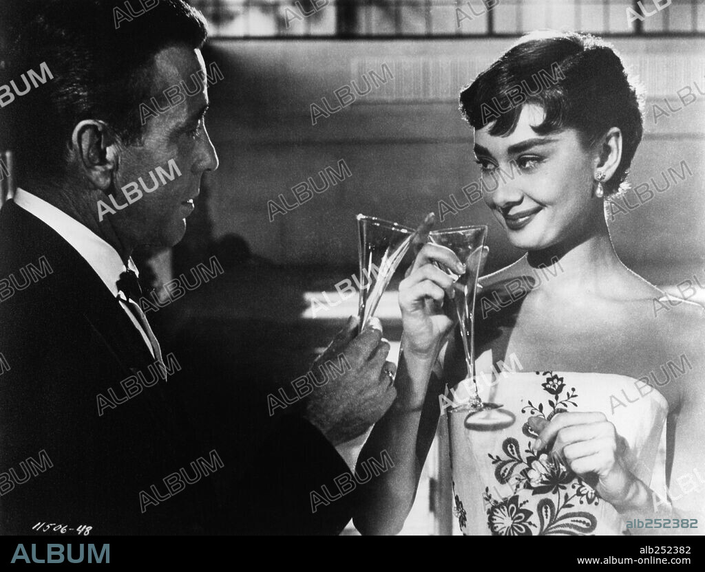 AUDREY HEPBURN und HUMPHREY BOGART in SABRINA, 1954, unter der Regie von BILLY WILDER. Copyright PARAMOUNT PICTURES.