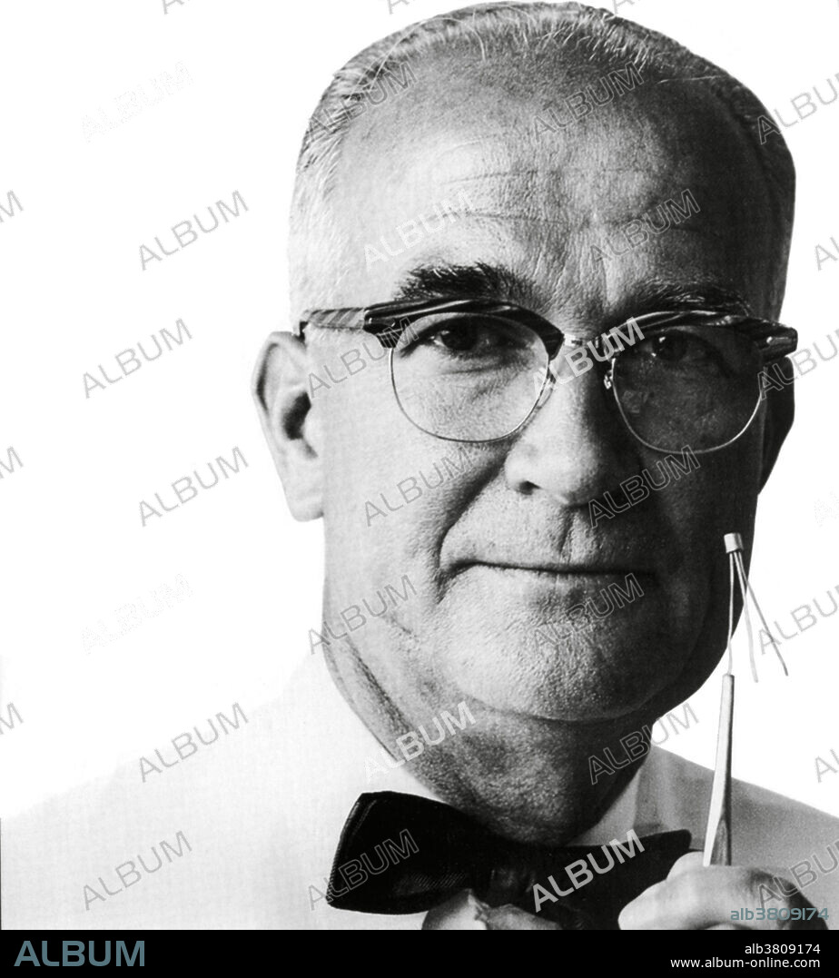 William Shockley (1910-1989), US physicist and co-inventor of the transistor. He is holding a transistor. Shockley worked at Bell Telephone Laboratories (Bell Labs) with his researchers John Bardeen and Walter Brattain. In December 1947 they created the first transistor, a solid state switch now used in practically every electronic device. The three men shared the 1956 Nobel Prize for Physics for this work. Shockley later fell out with the other two over that and subsequent work.
