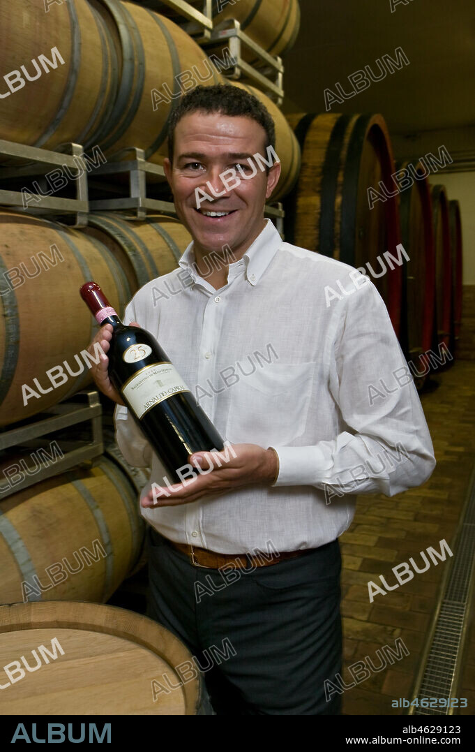Winery Arnaldo Caprai: Marco Caprai, owner of the "Cantina Arnaldo Caprai" amont the barrels of the Sagrantino wine of Montefalco.