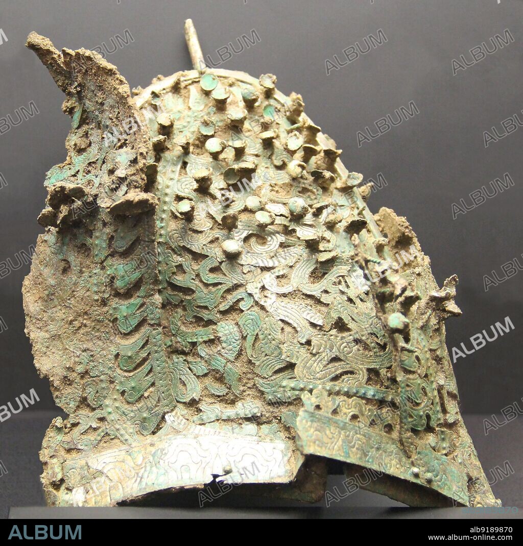 South Korea: Gilt bronze cap, Baekje Kingdom, Three Kingdoms Period (18 BCE - 668 CE), National Museum of Korea, Seoul.<br/><br/>. Baekje/Paekche was one of the Three Kingdoms of Korea, alongside Goguryeo and Silla. Located in southwestern Korea, the kingdom was foudned by Onjo, third son of Goguryeo's legendary founder Jumong, at Wiryeseong (modern-day southern Seoul).<br/><br/>. Baekje often fought and allied with the other kingdoms, and was at its peak power in the 4th century, when it controlled most of the western peninsula and perhaps even territories in China such as in Liaoxi. It was a significant sea power, and had relations with China and Japan; some have called Baekje the Phoenicia of East Asia.<br/><br/>. Baekje fell in 660 CE after being defeated by Silla and the Tang Dynasty, and was subsumed into Unified Silla.