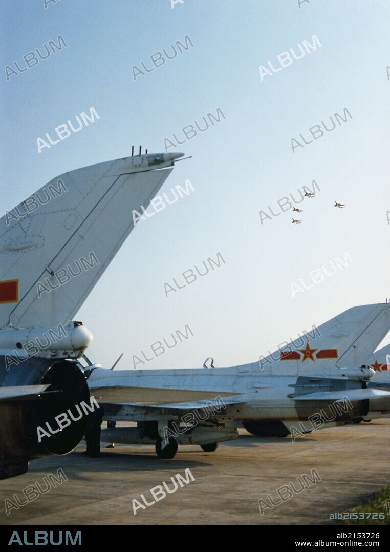 Chengdu J-7 jet fighters of the Chinese East China Sea Fleet flying in formation. China. 1994. (Photo by: Sovfoto/UIG via Getty Images).