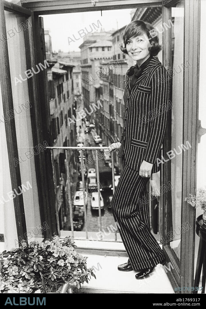 Rossella Falk at her home in Rome. The Italian actress Rossella Falk, smiling, photographed at her own home, outside on the balcony that looks onto a street in the old part of the city. Rome, 1974.