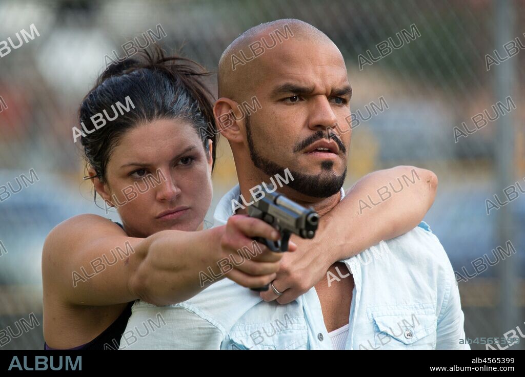 AMAURY NOLASCO and GINA CARANO in IN THE BLOOD, 2014, directed by JOHN STOCKWELL. Copyright ANCHOR BAY FILMS.