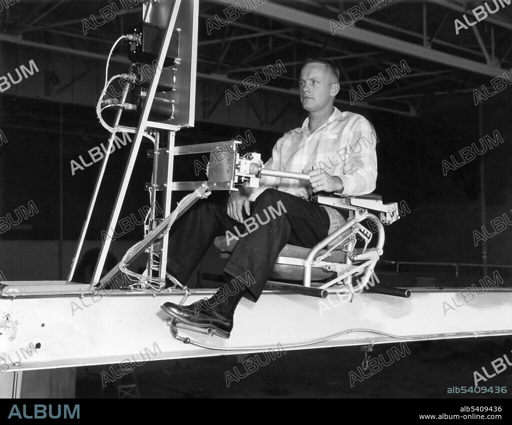 Neil Armstrong flies the Iron Cross Simulator. The Iron Cross was a ground-based simulator for testing early reaction controls. It is primarily orbital, suborbital and hypersonic vehicles that require reaction control capability, but it was recognized in the 1950s that the earliest flight evaluation of reaction controls would occur with supersonic research aircraft. It was also believed that the flight research should be preceded by ground-based simulation studies. The pioneering jet reaction simulation work at NACA High-Speed Flight Station was a two-phase study; one was a fixed-base setup with an analog computer to solve the equations of motion and the other used a three-degree-of freedom mechanical simulator wherein the pilot experienced motions. The Bell X-1B airplane offered an ideal testbed for a trial reaction control installation. In preparation, NACA High-Speed Flight Station technicians built an iron-frame simulator, dubbed the Iron Cross, which matched the dimensions and inertial characteristics of the X-1B, installing small reaction control thrusters on it and then mounting it on a universal joint so that a test pilot could maneuver it in pitch, roll, and yaw. The universal joint from a truck permitted motion about the three axes. High-pressure nitrogen gas was expanded selectively through the six jet nozzles to provide the reaction forces. Flight-type recorders were used to record control stick position and the various angular rates. October 8, 1956.