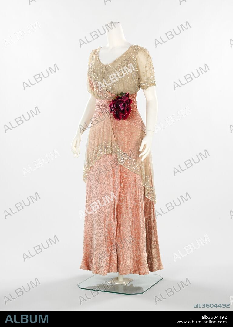 Evening dress. Culture: American. Designer: Herbert Luey (American, Northfield, Massachusetts 1860-1916 Brooklyn). Date: 1912-14.
This dress was most likely worn by Amelia Beard Hollenback (1877-1969), daughter of the prominent financier and philanthropist John Welles Hollenback (1835-1927). In 1874, the Hollenback family settled in the affluent neighborhood of Clinton Hill in Brooklyn, and became devoted clients of Herbert Luey, a Brooklyn-based dressmaker. This dress conveys a sense of spontaneity through the combination of materials and layered effect and exemplifies Luey's draping talent.