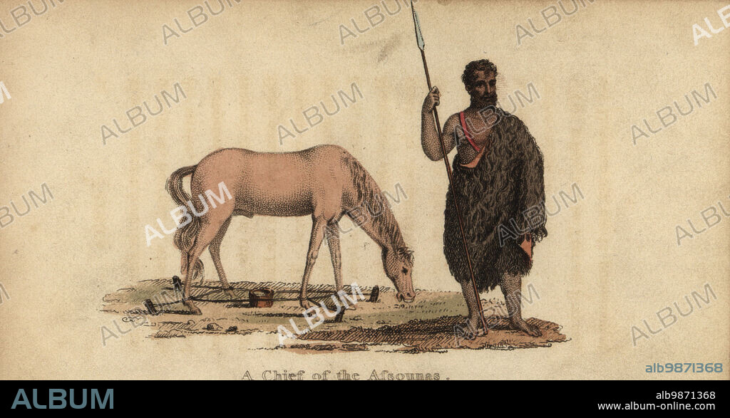 Chief of a nomadic Moorish tribe, Senegambia, 18th century. The Assounas enslaved people from south of the Senegal River. The horse is tethered by ropes to four stakes in the ground. A Chief of the Assounas. After Rene Claude Geoffroy de Villeneuves LAfrique, Paris, 1814. Handcoloured stipple copperplate engraving from Frederic Shoberls The World in Miniature: Africa, A description of the manners and customs Moors of the Sahara and of the Negro Nations, R. Ackermann, England, 1821.