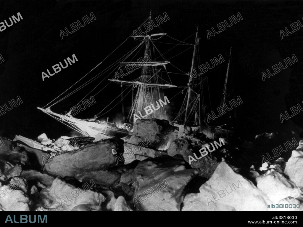 Antarctic winter flashlight scene in the Weddell Sea, showing Endurance stuck fast. Endurance was the three-masted barquentine in which Ernest Shackleton sailed for the Antarctic on the 1914 Imperial Trans-Antarctic Expedition. She was within 200 miles of her destination, Vahsel Bay, when heavy pack ice was sighted and a gale developed. She took shelter under the lee of a large grounded berg. On January 18 the gale began to moderate and the pack had blown away. Progress was made until hours later Endurance encountered the pack again. By January 24, the wind had compressed the ice in the whole Weddell Sea against the land. Endurance was icebound. All that could be done was to wait for a southerly gale that would start pushing, decompressing and opening the ice in the other direction. The changing conditions of the Antarctic spring brought such pressure that broke the hull of Endurance causing flooding of interior spaces. On the morning of November 21, 1915, her bow began to sink under the ice and had to be abandoned.