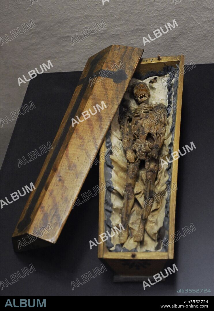 Memento mori in the form of a small coffin. Southern Germany (?), 18th century. Wax figure on silk in a wooden coffin. Museum Schnu_tgen. Cologne, Germany.