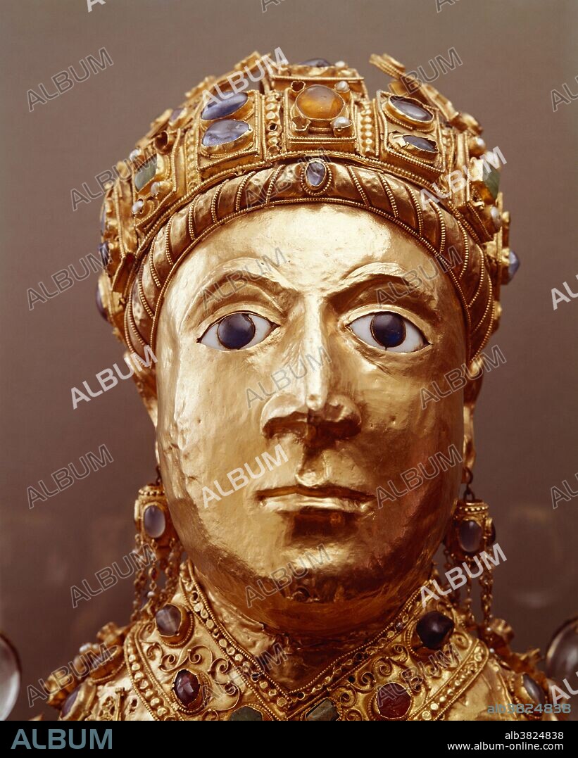 Reliquary statue of Sainte Foy (Saint Faith), detail of head, c. 980, Sainte-Foy Abbey Church, Conques, France. The remains of St. Foy, a martyred young woman from the fourth century, was the main draw for medieval pilgrims to the Church. The gilded reliquary has been theorized to be either an imperial portrait of the Later Roman Empire or a portrait or death-mask of Charlemagne.