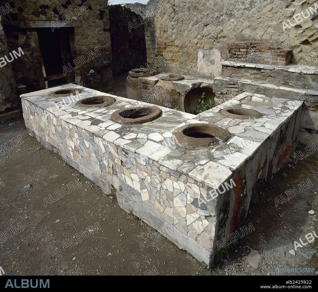 Italy. Pompeii. Marble covered counter Thermopolium.  Located between Cardo V and Lower Decumanu. Campania.