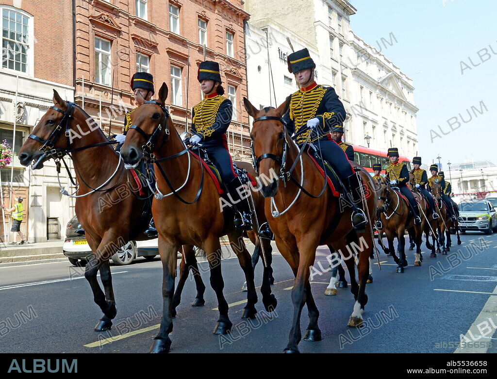 Female members of the King's Troop, Royal Horse Artillery in blue light cavalry-style full dress uniform, parade along Whitehall, London..
