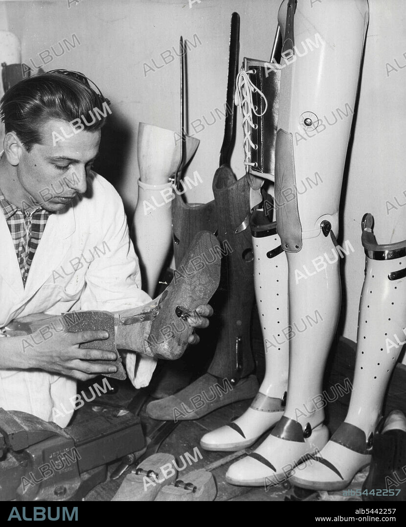 Artificial Limb specialists... Mr. Gunter Kairies of Herene Bay, an orthopedic mechanic or artificial limb specialist working on a leg at the A.L.A. Co. Carlton. November 02, 1955. (Photo by George Lipman/Fairfax Media).