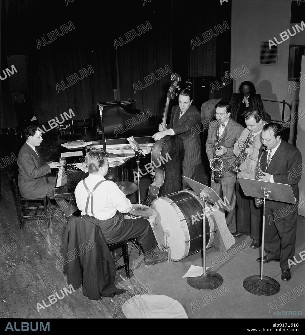 WILLIAM PAUL GOTTLIEB. Portrait of Stan Freeman, Bunny Shawker, Bob Haggart, Art Drelinger, Billy Butterfield, Toots Mondello, and Mary Lou Williams, Columbia studio, New York, N.Y., ca. Mar. 1947.