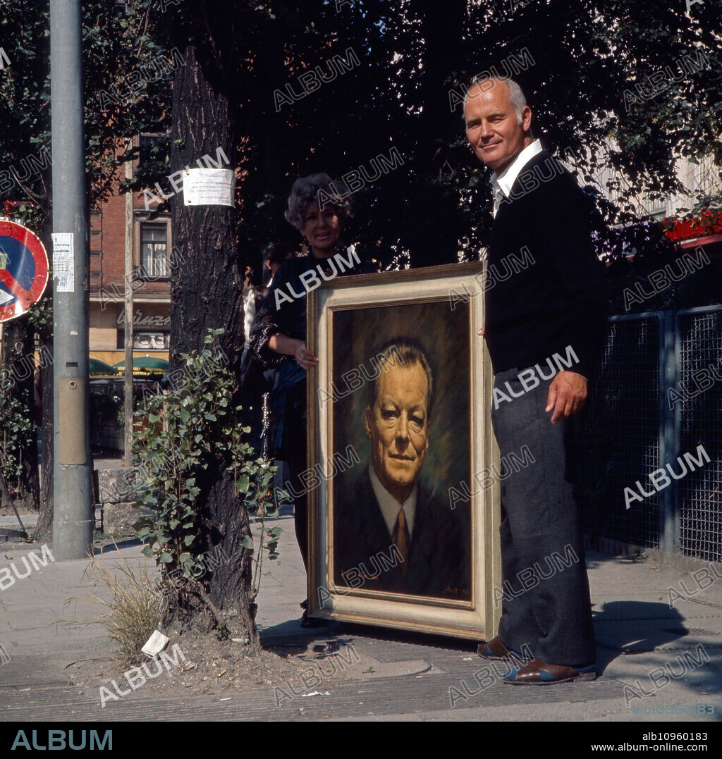 Painter Walter Muth with a painting showing chancellor Willy Brandt, Germany 1970s.