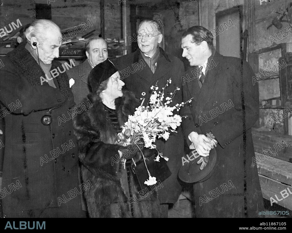 Old Vic School opened. Today, Friday, Miss Ellen Wilkinson, Minister of Education, opened the newly established Old Vic Theatre School housed at the original Old Vic Theatre, Waterloo Road, London. Under the direction of the principles M Michael , St Denis and Mr Glen Byam Shaw, 70 students, selected from 300 applicants, will use set all down to 2 years 'hard labour' studying every branch of acting and stage design and stage management on their curriculum. At today's ceremony. Miss Wilkinson was received by Lord Lytton, Chairman of the Governors of the Old Vic, Mr Laurance Oliver, a Governor of the Old Vic, and Sir Ernest Pooley, Chairman of the Arts Council of Great Britain. Photo shows, left to right, Lord Lytton, Miss Ellen Wilkinson Mr Laurence Oliver and behind M Michael St Denis, and Sir Ernest Pooley, when the Minister of Education, arrived at the Old Vic today. 24 January 1947.