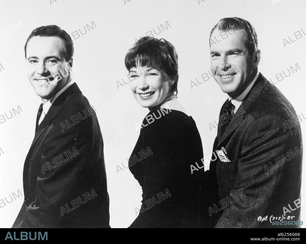 FRED MACMURRAY, JACK LEMMON and SHIRLEY MACLAINE in THE APARTMENT, 1960, directed by BILLY WILDER. Copyright UNITED ARTISTS.