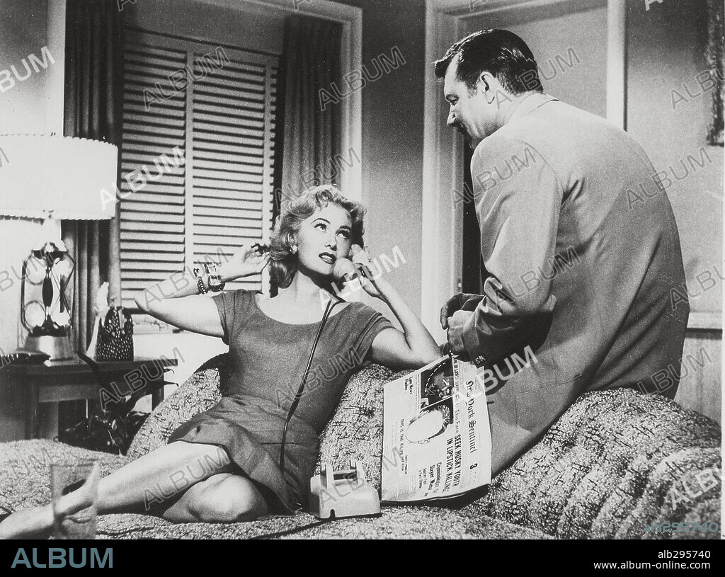 JAMES CRAIG and RHONDA FLEMING in WHILE THE CITY SLEEPS, 1956, directed by FRITZ LANG. Copyright RKO.