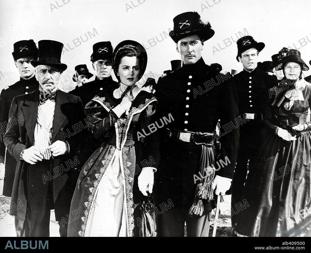ERROL FLYNN, OLIVIA DE HAVILLAND and RONALD REAGAN in THE SANTA FE TRAIL, 1940, directed by MICHAEL CURTIZ. Copyright WARNER BROTHERS.