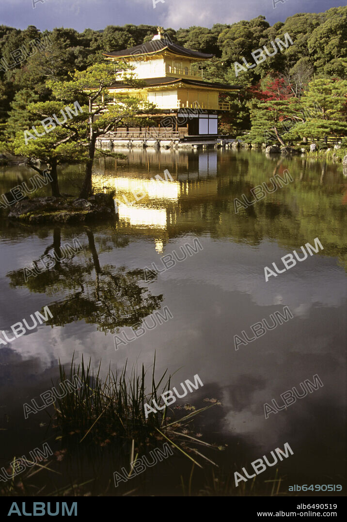 Kinkaku - the Golden Pavilion - is the name given to Rokuon-ji Temple on Kyoko-chi pond in Kyoto. Built as a 
villa for the retirement of the 3rd Shogun of Ashikaga in 1394, it was made into a Zen-temple according to the Shogun's will. The second and third floors are covered with gold leaf on Japanese lacquer; on the roof is a golden phenix.