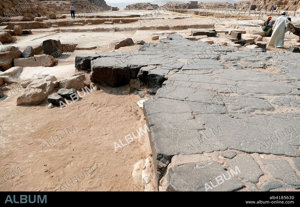 Remains of a stone floor at the temple sites near the Great Pyramid of Giza (Pyramid of Khufu or Pyramid of Cheops). oldest and largest of the three pyramids in the Giza pyramid complex in Egypt. It is the oldest of the Seven Wonders of the Ancient World. and the only one to remain largely intact. Completed around 2560 BC.