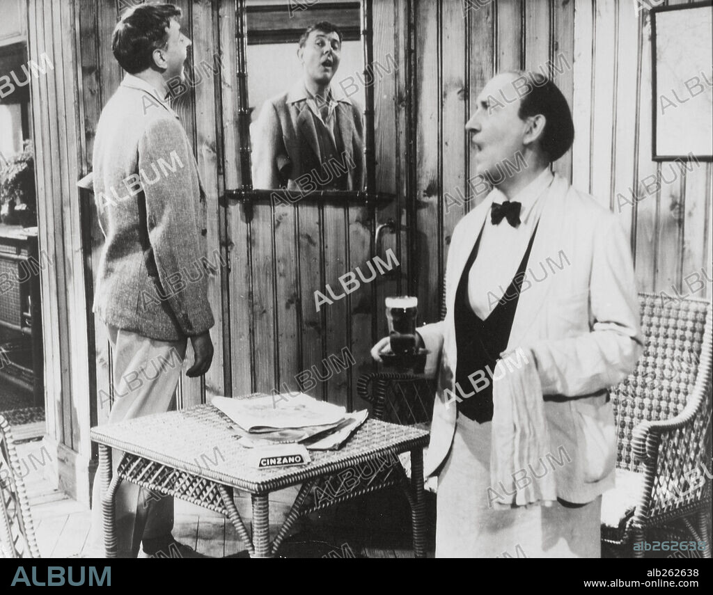JACQUES TATI and LUCIEN FREGIS in MR. HULOT'S HOLIDAY, 1953 (LES VACANCES DE MONSIEUR HULOT), directed by JACQUES TATI. Copyright CADY/DISCINA.