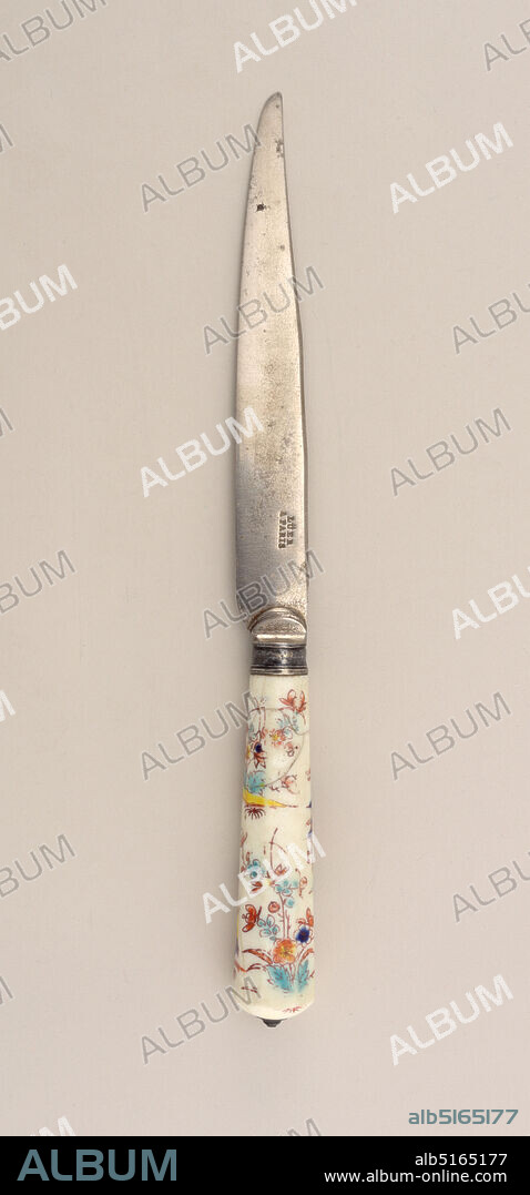 Knife with Floral Porcelain Handle, Chantilly Porcelain Manufactory, French, active ca. 1725 - ca. 1789, porcelain, vitreous enamel, steel, silver, Blade has slightly bent upper edge, lower edge tapering towards the point. Drop bolster, plain silver ferrule with horizontal band. Tapering, octagonal white porcelain handle decorated with kakiemon design in yellow, blue and green (underglaze) and brown-red (overglaze). Top of handle rounded, silver cap., France, 17251750, cutlery, Decorative Arts, knife, knife.