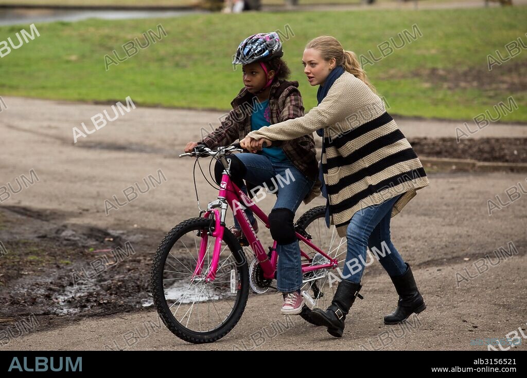 AMANDA SEYFRIED and QUVENZHANE WALLIS in FATHERS AND DAUGHTERS, 2015, directed by GABRIELE MUCCINO. Copyright VOLTAGE PICTURES.