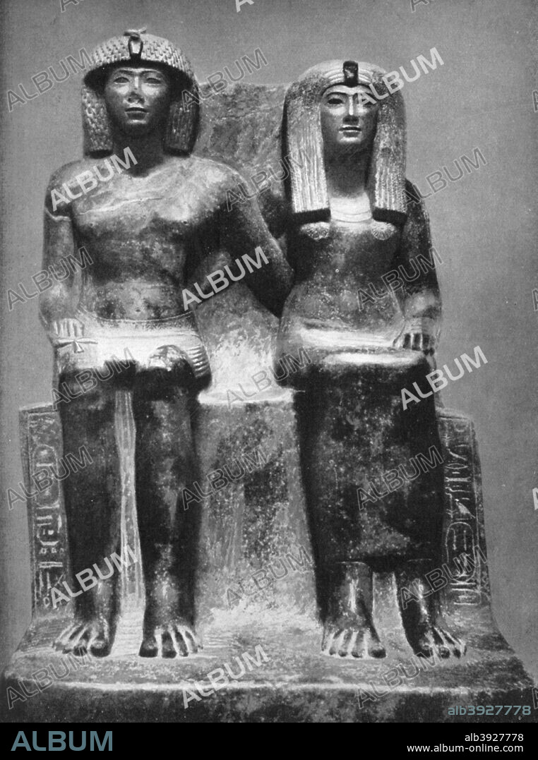 Pharaoh Thutmose IV and his queen, 1933-1934. Black granite group, discovered at Karnak. Thutmose IV was the eighth Pharaoh of the 18th Dynasty of Egypt. He reigned from 1401 until 1391 BC. From the collection of the Cairo Museum. A print from Wonders of the Past, Volume I, 1933-1934.