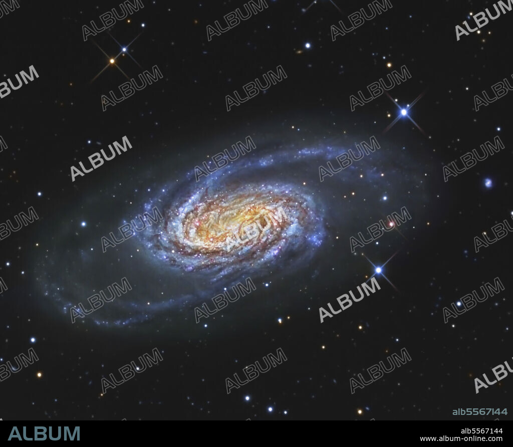NGC 2903 is a barred spiral galaxy in the constellation of Leo. It is noted for it multiple hot spots of intense star forming regions.