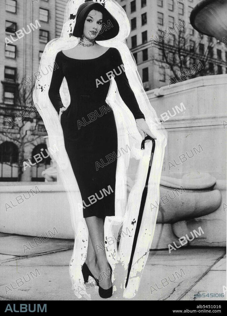 Right as an Easter Lily - and bound for fashion fame in the big parade is this smartly stream-lined eminently femine dress -- by Bonnie Cashin. Made in softest "cloud-light" wool jersey of Navy Blue, it has gently moulded bodies, easy slim-lined skirt. Low-out neckline, and wrists of zipper-snug sleeves, are edged with fine *****. Hat by Bonnie Cashin. Jewelry by coro. June 20, 1951. (Photo by The Wool Bureau, Inc.).