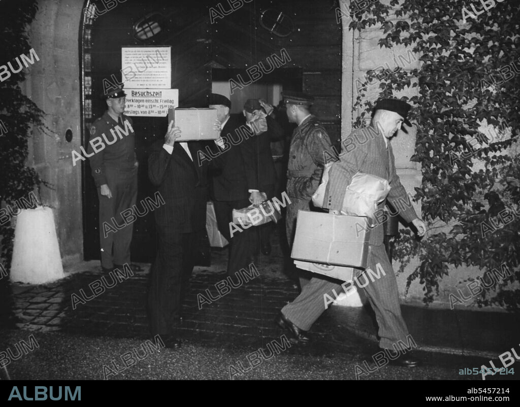 Nazi war Criminals Released From Prison -- Nazi war criminals are seen as they were released from Landsberg prison, Bavaria, Aug. 25. They are shiedding their faces with packages and hats.Friedrich Flick, prominent steel magnate of the Hitler era, and 18 other former Nazis were released form the Landsberg war crimes prison on Aug. 25. They were freed for good conduct after serving two-thirds of their seven year sentences. Others who won their freedom included Otto Dierich, 50, former Hitler press chief, Fritz ter mer, former director of the I.G. Farben chemical combine and Rudolph Lehmann, former lawyer, judge and Wehrmacht General. September 13, 1950. (Photo by Associated Press Photo).