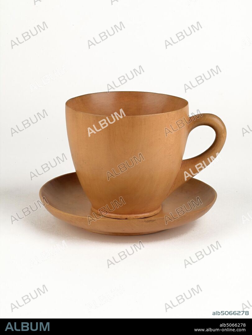 Turned, Wooden Tea Cup and Saucer, 1800-1900 Wooden cups and saucers are unusual objects and it is rare to find such a finely turned piece as this pear wood example. It was probably made in England during the 19th century. It would have been made as a virtuoso piece, to show off the considerable skill of the turner, rather than as a functional item. Social history, Wood.