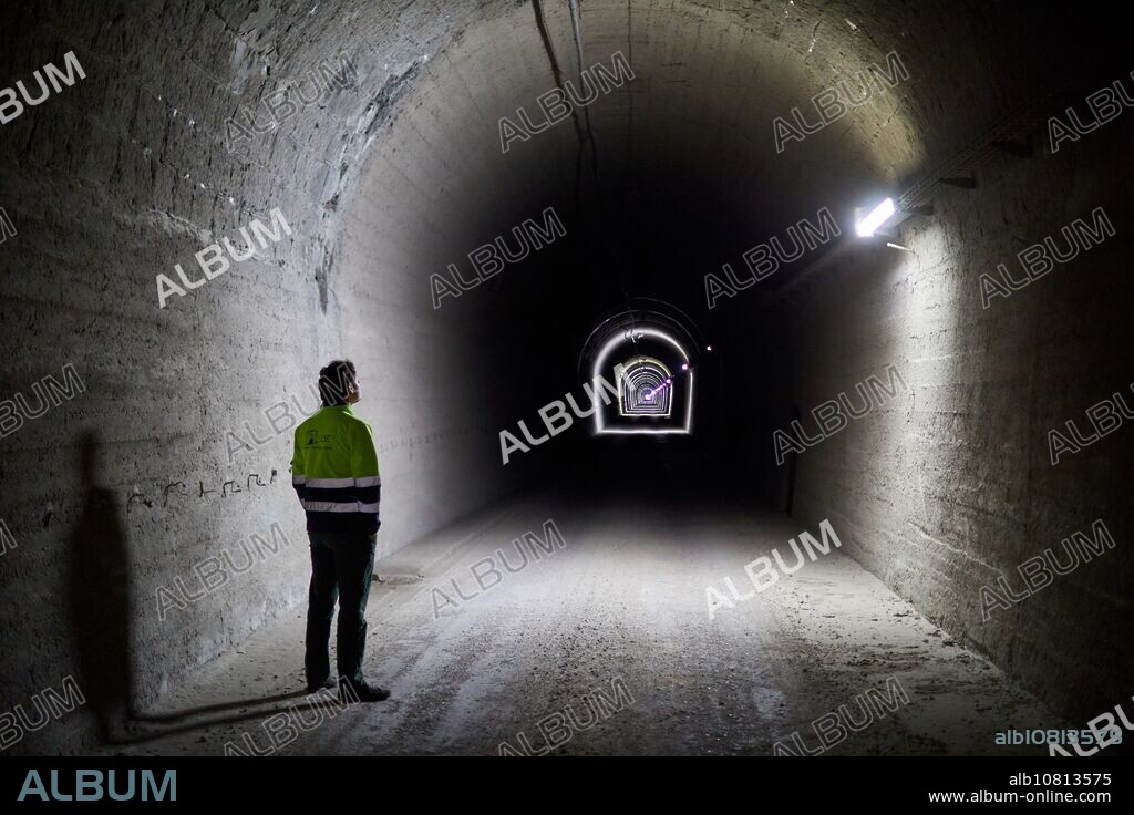 Somport Railway Tunnel, The Laboratorio Subterraneo de Canfranc (LSC) has been excavated in the rock 800 m deep under the Mount Tobazo in the Spanish side of the Aragon Pyrenees. The rock filters the cosmic radiation providing the "cosmic silence", which is necessary to study rarely occurring natural phenomena such as the interactions with an atomic nucleus of neutrinos of cosmic origin or of particles of the invisible "dark matter". Dark matter provides 85% of the mass of the Universe, but we do not know what it is made of.", Canfranc, Huesca, Aragon, Spain, Europe.