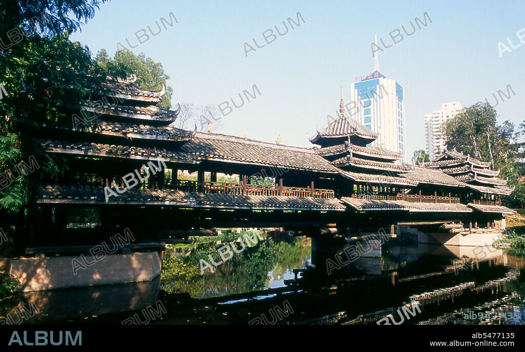 The Dong, a Kam-Sui people of southern China, are one of the 56 ethnic groups officially recognized by the People's Republic of China. They are famed for their native-bred Kam Sweet Rice, carpentry skills, and unique architecture, in particular a form of covered bridge known as the 'wind and rain bridge'. The Dong people live mostly in eastern Guizhou, western Hunan, and northern Guangxi provinces. Small pockets of Dong speakers are also found in Tuyen Quang province, northern Vietnam. Nanning was originally founded during the Yuan Dynasty (1271 - 1368), although there was a county seat here called Jinxing as far back as 318 CE. Opened to foreign trade by the Chinese in 1907, Nanning grew rapidly. From 1912 to 1936 it was the provincial capital of Guangxi, replacing Guilin. Due to its proximity to the Vietnamese border Nanning became a major centre for supplying Ho Chi Minh's North Vietnam during the Second Indochina War (Vietnam War).